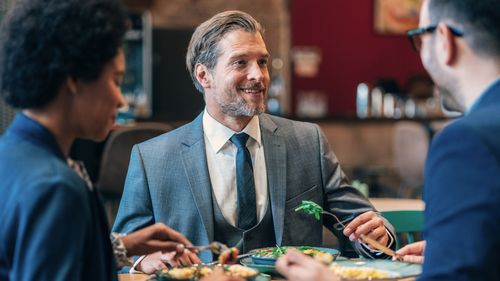 Businessman eating salad